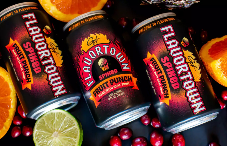 Three Flavortown Spiked Fruit Punch cans with fruit